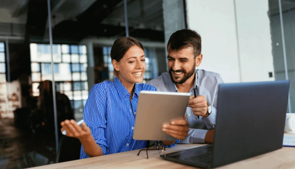 two-people-work-together-to-fill-form-3800