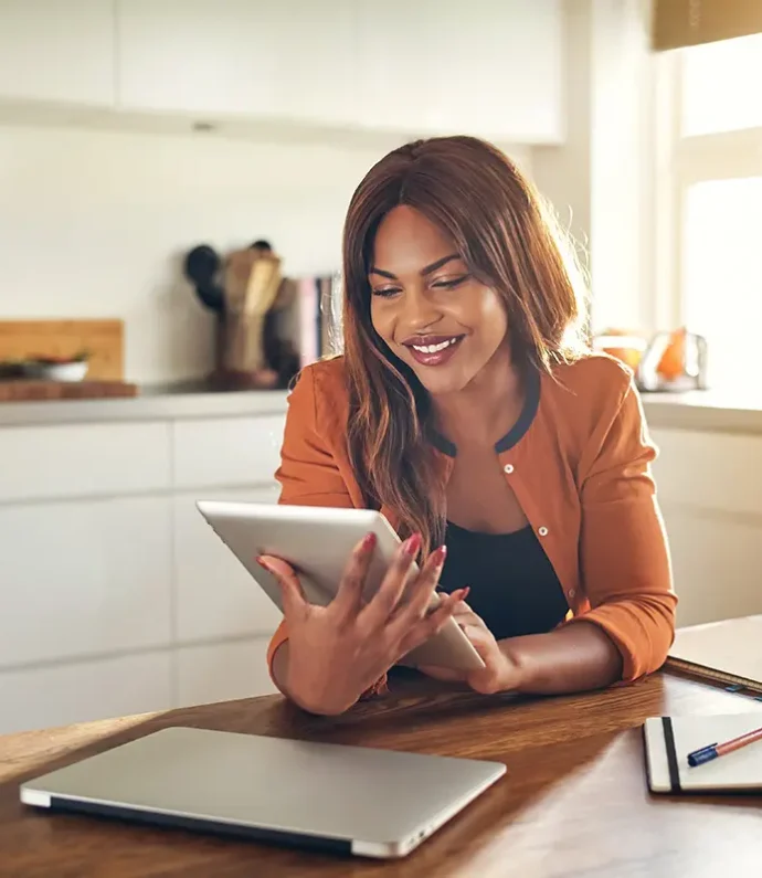 Female-Entrepreneur-Using-a-Tablet-in-Her-Kitchen Female-Entrepreneur-Using-a-Tablet-in-Her-Kitchen